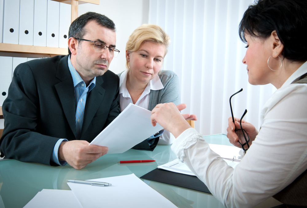 Man and woman discuss case with a car accident lawyer